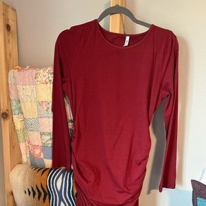 Mid length dress with 3/4 sleeves and gathered sides